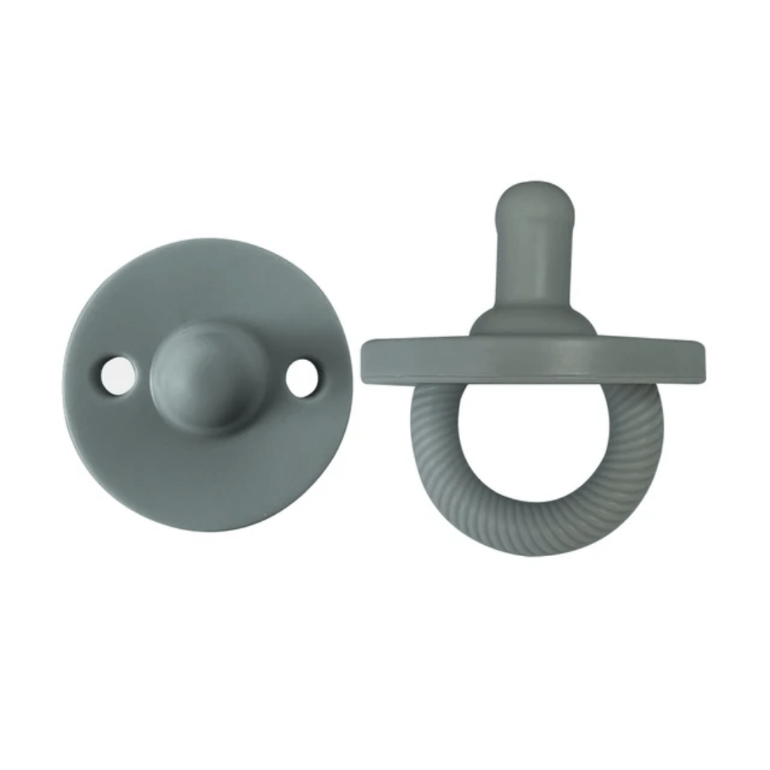 Two gray pacifiers on a white background. Itzy Silicone Pacifiers