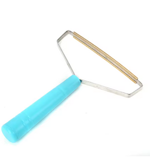 Textured tool with a blue handle on a white background