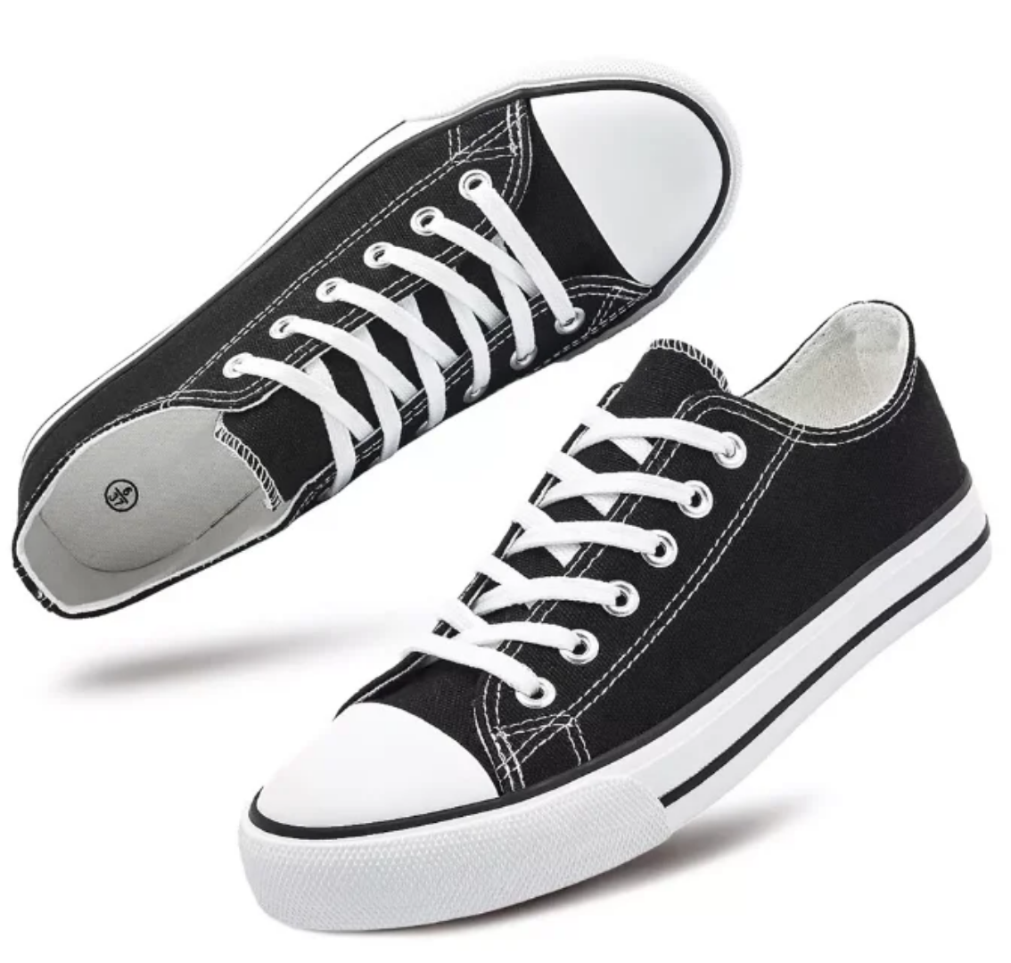 Black sneakers with white laces on a white background