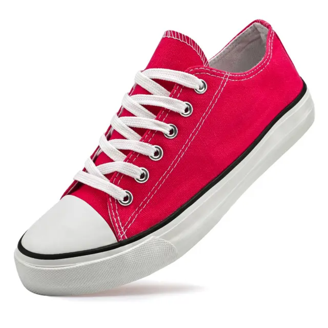 Red sneaker with white laces on a white background